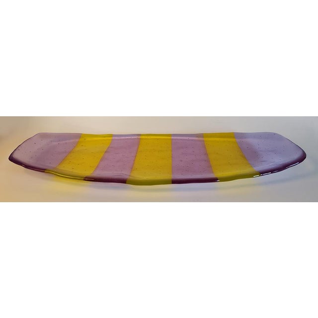 Beautiful art glass tray with two color design in lavender and yellow. It is practical to use as a home decor display and...
