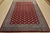 A tribal Bokhara Jaldar rug hand-knotted with fine wool on a cotton foundation. This rug features rows of repeating...