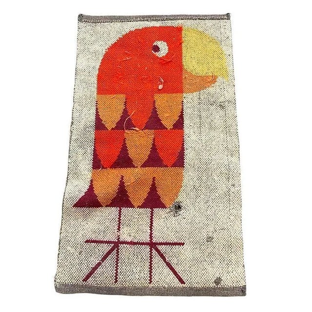 Hand-hooked late Mid-century wool tapestry rug featuring a Modernist abstract portrait of a Parrot done in yellow, orange,...