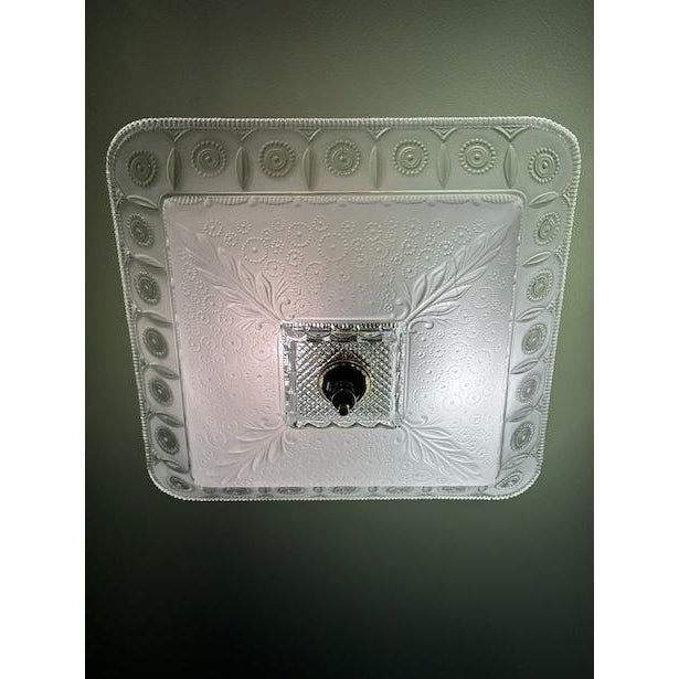 Used light fixture, the glass is in very good condition. The lamp shade is made of frosted glass and has sunflowers and...