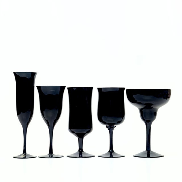 Black stemmed decorative glasses, group of 9. A glamorous, curated, decorative group of black-stemmed glasses from the mid...