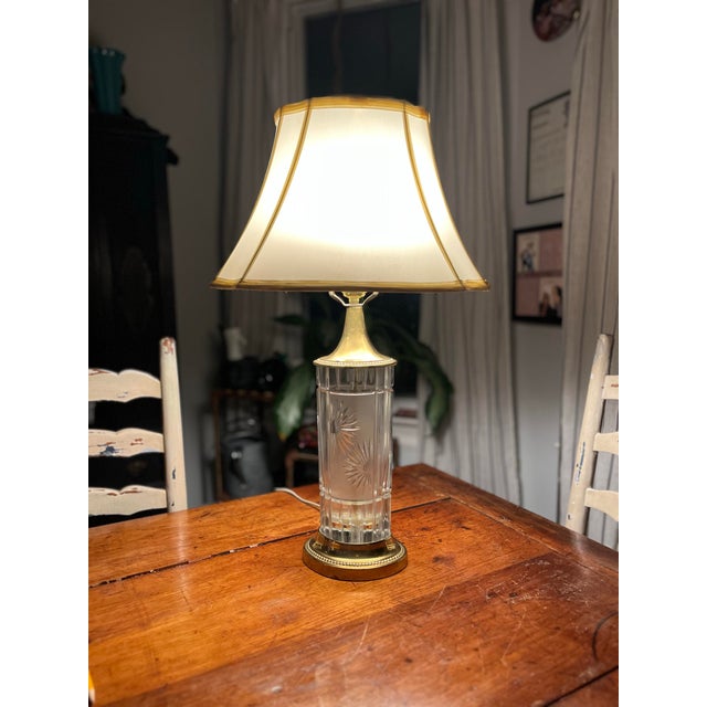 This striking mid-century modern table lamp features a brilliant column of thick, authentic German Dresden cut crystal....