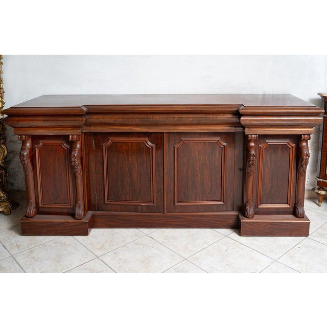 Antique four-door sideboard/credenza in finely carved mahogany, Victorian era, 19th century. General Condition: Excellent...