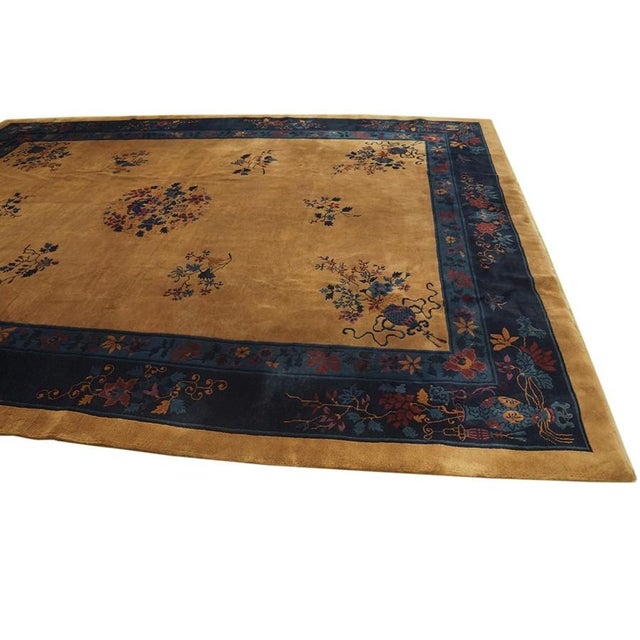 Antique Art Deco Chinese Floral Blue and Yellow 1920s Rug, Circa Date: 1920s. This exceptional textile captures the...