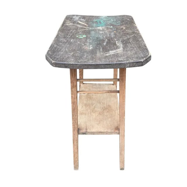 This vintage side table from Hungary with a lower shelf is a charming piece of furniture crafted from quality wood in...