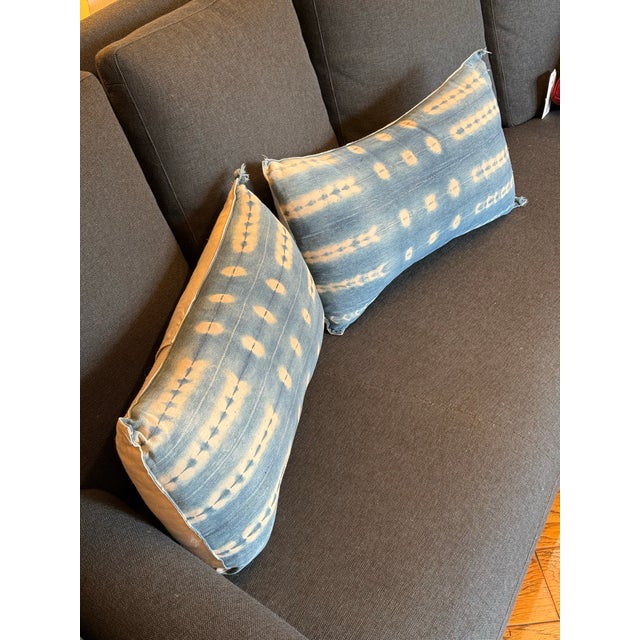 Design Plus Gallery presents a Pair of Custom Design Vintage Indigo Lumbar Pillows. Each pillow is covered in an indigo...