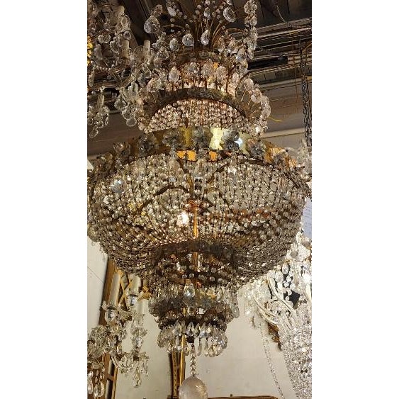 This listing features a bronze belt and rock crystal Chandelier, with glass rosettes. Five tiered with a large crystal...