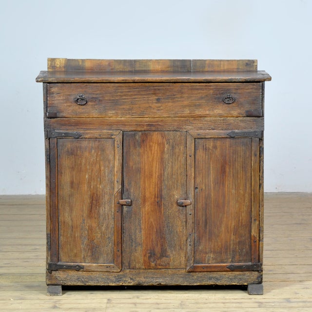 Antique pine cabinet, estimated to date from around 1820. This characterful piece is crafted from solid, weathered pine...