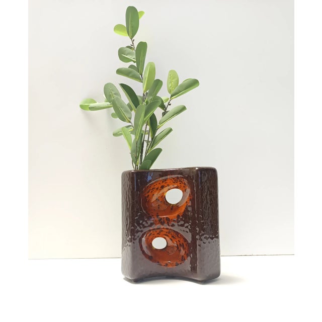 Made in Italy by Giovanni Bertoncello, 1970s. It is made in brown and orange hand-glazed ceramic. This vase is signed on...