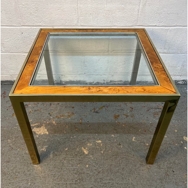 Add a touch of timeless mid-century sophistication to your interior with this elegant glass side table, beautifully...