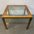 Add a touch of timeless mid-century sophistication to your interior with this elegant glass side table, beautifully...