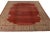 A 10x13 antique Persian rug of Sultanabad origin and rare open-field design in red and beige-brown. Hand-knotted in wool...