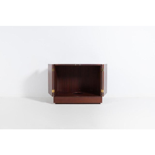 Unique mahogany veneer bar cabinet by Danish furniture maker. At the bottom part a slide out plateau with a space for a...