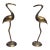 A Pair of Vintage Solid Brass Crane Figurines Standing Gracefully on Round Bases With a Warm, Aged Patina. For Sale