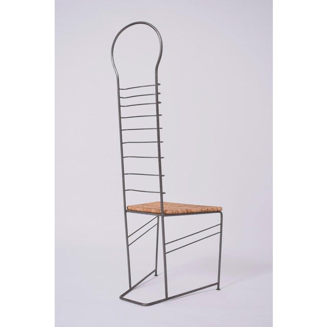 1980's pair of chairs with tubular iron structure and a high back, with a straw seat. Length (cm): 43 Width (cm): 48...