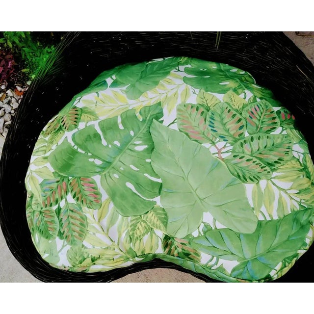 A custom upholstered very large wicker heart shaped dog bed. The bed has a super sturdy with wicker surround and wood...