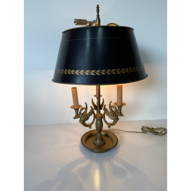 Elegant and richly detailed, this Early 20th Century French Bouillotte Lamp showcases refined bronze craftsmanship and...