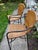 A pair of bar or counter stools. Frame is iron and seat / back is wicker. Wicker is tight and frame is all intact.