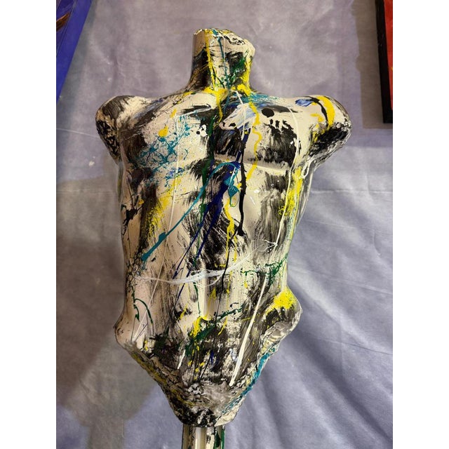 This resin sculpture, created by artist Silvio Formichetti, features a stylized male bust that combines the strength of...