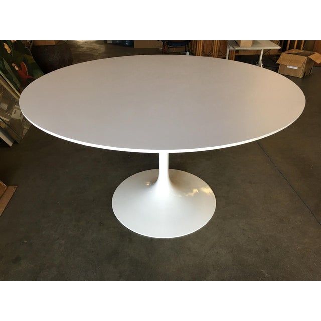 Mid-century 42" inch diameter "Tulip" dining table with an aluminum base and laminate top. United Sates, 1956.