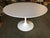 Mid-century 42" inch diameter "Tulip" dining table with an aluminum base and laminate top. United Sates, 1956.