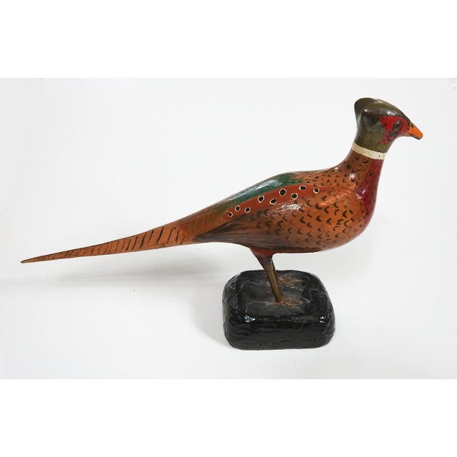 Pair of hand carved wood folk art sculptures of pheasants. Hand painted with glossy finish, glass eyes, unsigned. Felt...