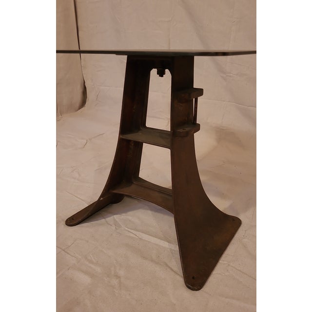 This is a unique vintage industrial side table with a steel base and top. Great old steel patina all over.