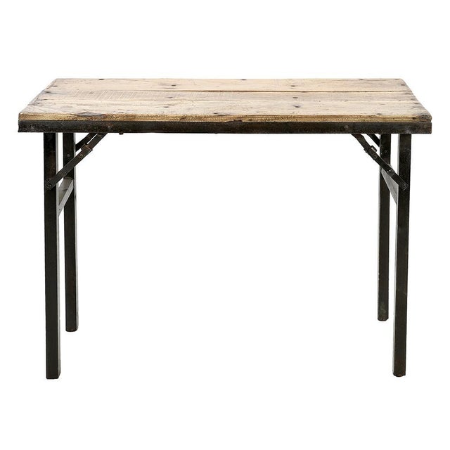 Folding Table in Metal & Teak, in Good conditions. This piece is designed in the style of the selected designer and/or...