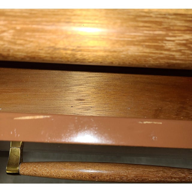 John Keal for Brown Saltman credenza measures: 20.5" D x 66" W x 32.75" H. The credenza is honey color mahogany wood,...