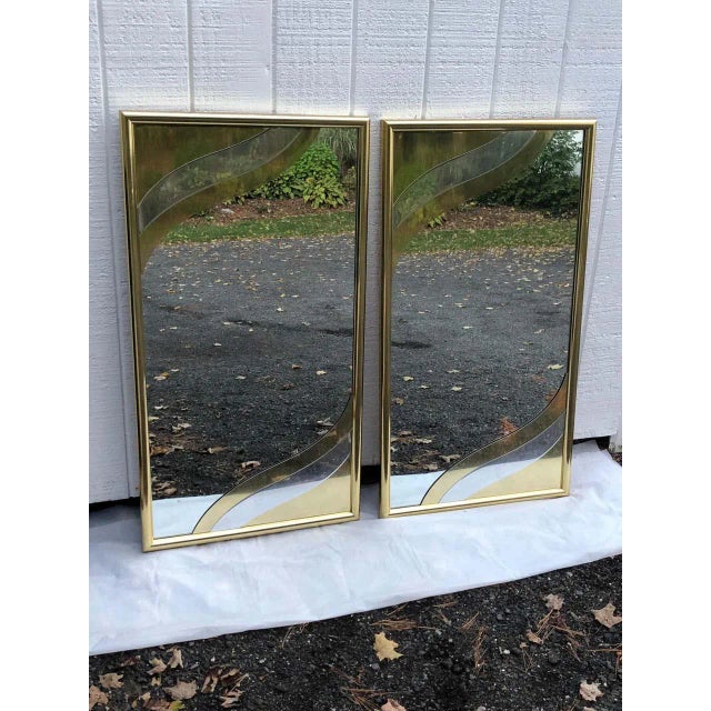 Pair of 1980s designer brass mirrors in the style of Curtis Jere. Amazing 3 D style design. Perfect for either above two...