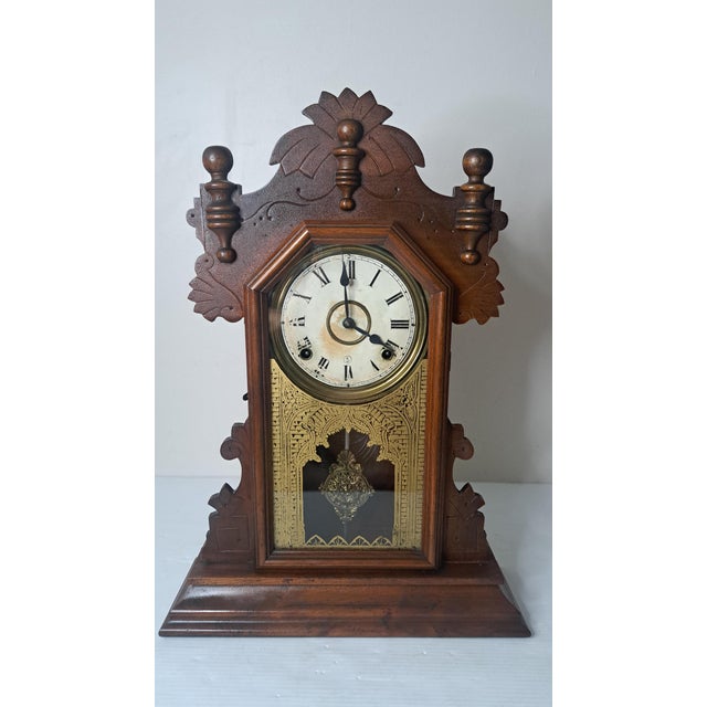 A beautiful Antique Ingraham Oak Gingerbread Parlor Clock dating from the late 19th to early 20th century. Crafted by the...