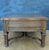 Substantial pair of Spanish classical revival side tables crafted in solid oak, mid-20th century. Each table features two...