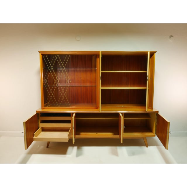 This original highboard from the 1960s consists of two sections and is of high-quality craftsmanship. It was produced by...