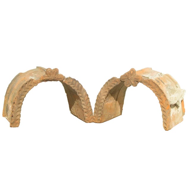 Pair of lovely French 19th C. unglazed terracotta architectural elements.. These barrel shaped pieces with a center floral...