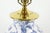 Blue and white ceramic table lamp with flowers and brass accents. This lamp features a ginger jar shape with a classic...