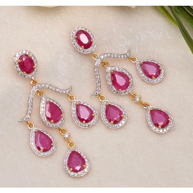 Gross Weight: 8.54 gms Gold Weight: 6.64 gms Gold Purity: 14K Yellow Gold Diamond Weight: 1.68 cts Ruby Weight: 7.82 cts...