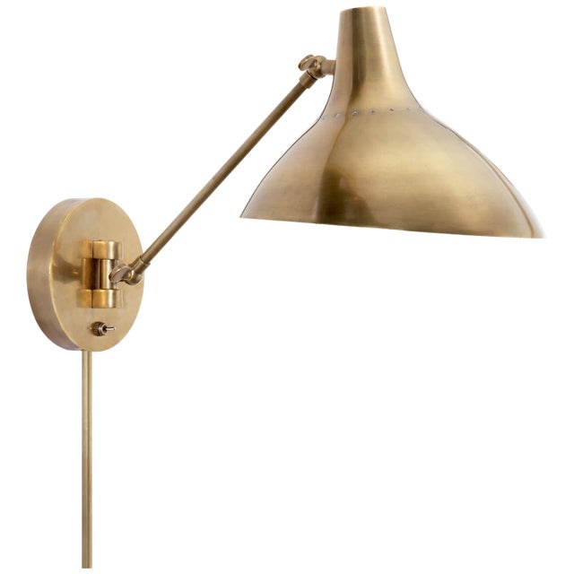 Charlton Wall Light in Hand-Rubbed Antique Brass Designer: AERIN Height: 7.5" - 14.5" Extension: 18" Backplate: 5.25"...