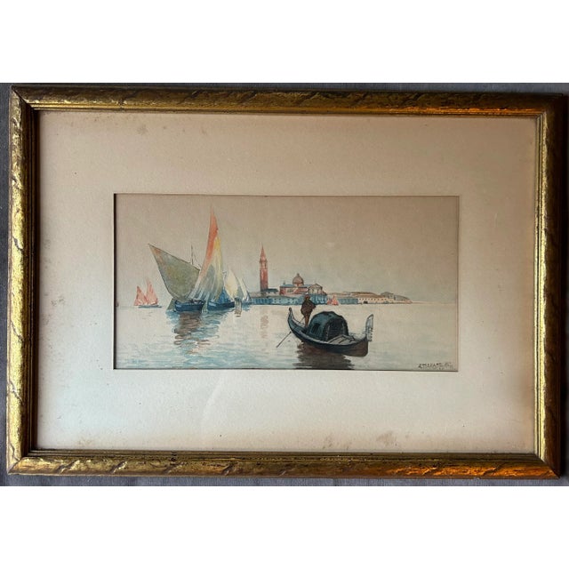 Beautiful antique watercolor of a Venetian scene on the water with city architecture in the background. Signed to the...