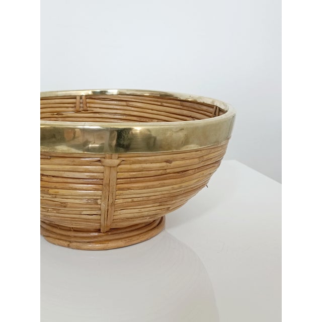 Beautiful fruit bowl. Italy, 1970s. Rattan frame. Brass rim. Diameter 30 cm. Height 14 cm. Excellent condition, minor...