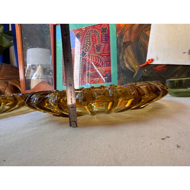 Up for consideration is a beautiful pair of amber colored glass ashtrays. These would look lovely on display in your home...