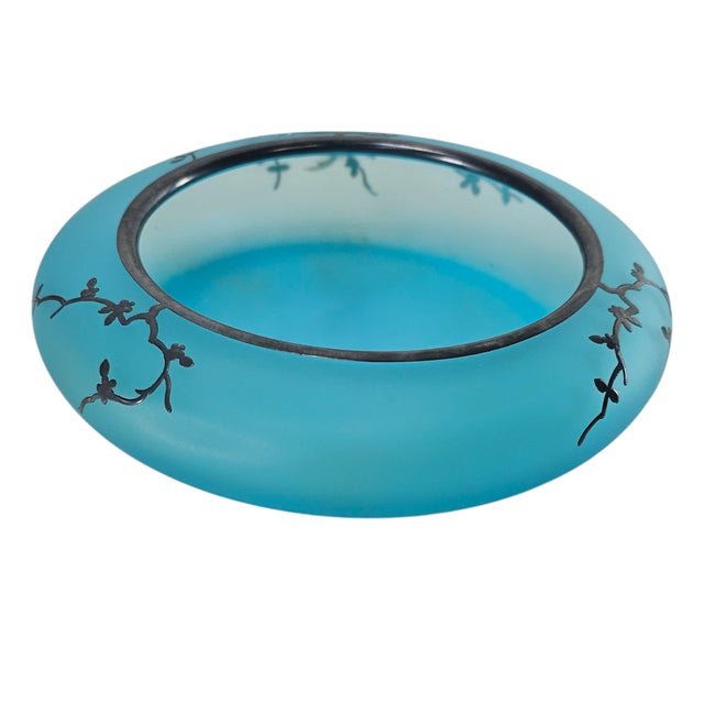 The elegance of a bygone era lingers in this exquisite Art Nouveau blue satin glass bowl, a delicate relic of early 20th-...
