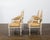 A set of four French Louis XVI style off-white painted oval back armchairs from circa 1900 with carved décor. This set of...