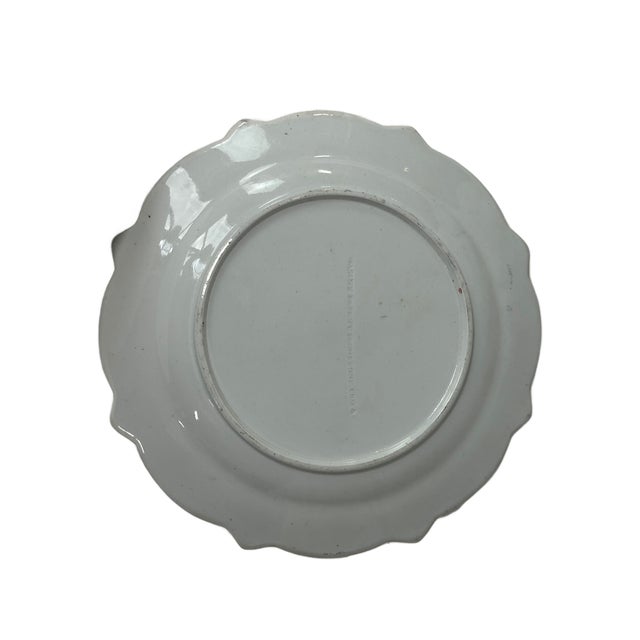 This is a vintage mid 19th Century Mason’s Patent Ironstone China cabinet plate featuring an Imari-inspired floral design....