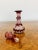 Quality antique Victorian glass spirit perfume bottle and stopper having a red and clear glass body with etched fruiting...