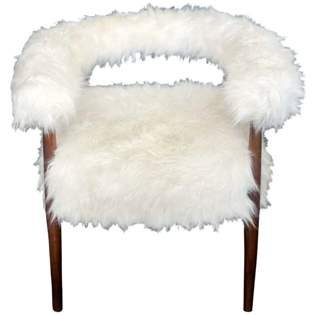 Pair of modern faux goat armchairs with a hoop back design and wooden chair frame. Made in Italy, c. 1970's. Dimensions:...