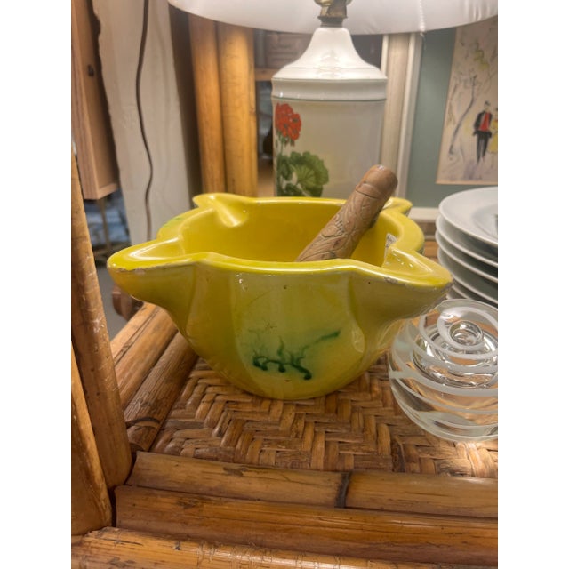 Lovely 1940s Ceramic mortar with carved wood pestle from France. Yellow glaze with green details. Handcarved pestle