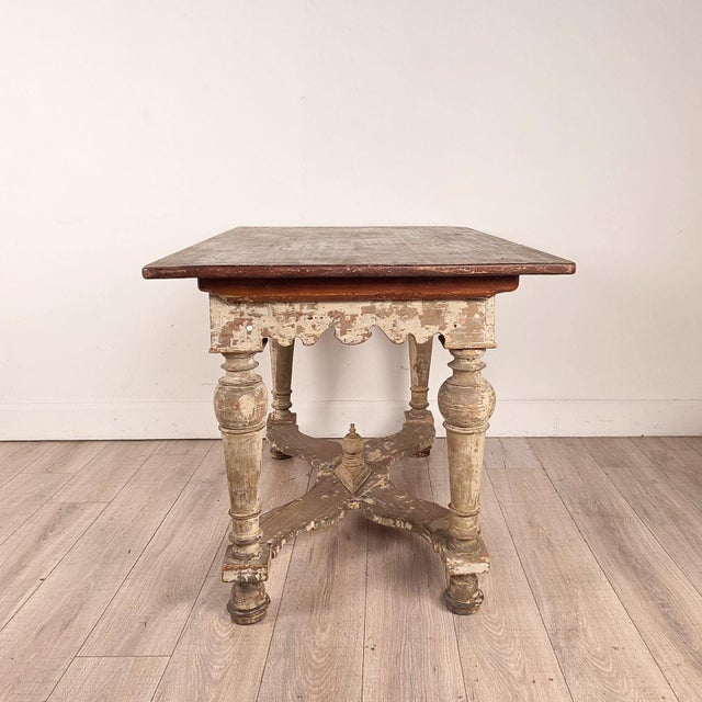 A 19th-century Swedish partially painted kitchen table with revesible top.