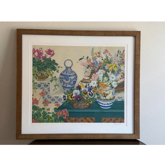 A vibrant and highly decorative limited edition serigraph titled Pansy Basket by American artist John Powell, hand signed...
