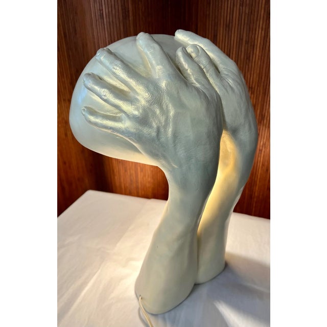 A plaster table lamp signed by Richard Etts. Etts is known for this iconic sculpture and lighting cast from hands in...