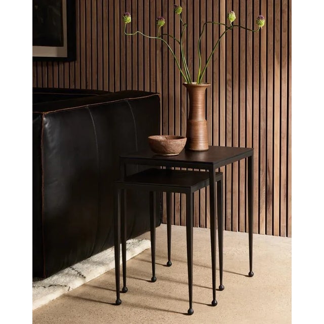 Slender styling adopts depth from swirls of antique tones. Tapered legs with rounded feet bring balanced footing to...